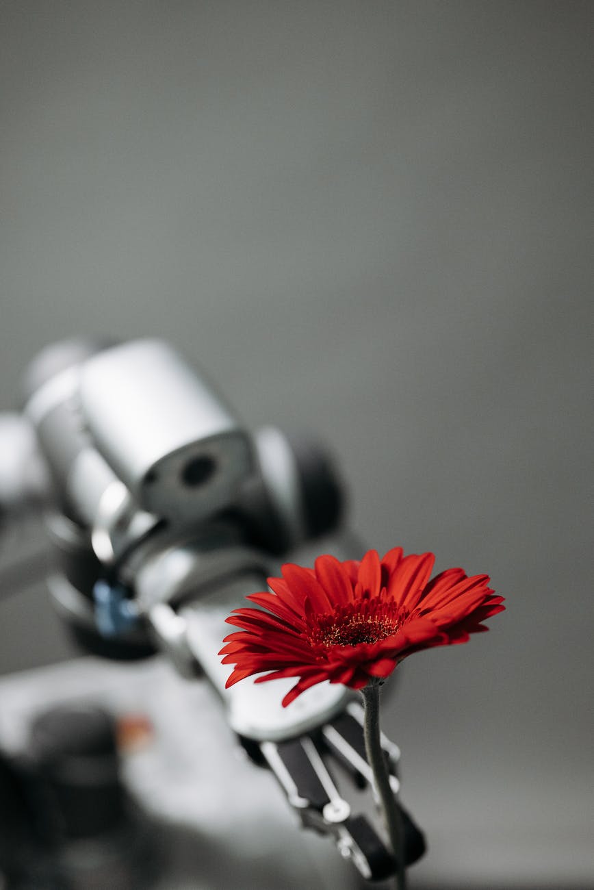 close up shot of a robot holding a flower