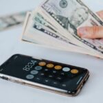 cash and calculator app on smartphone